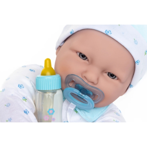 Lalka Hiszpańska 51 cm Berenguer 15344 La Baby, bobas z miękkim brzuszkiem, czapeczka, pajacyk w niebieskie kwiatuszki, niebieski smoczek przyszyty do ubranka, magiczna buteleczka z mlekiem