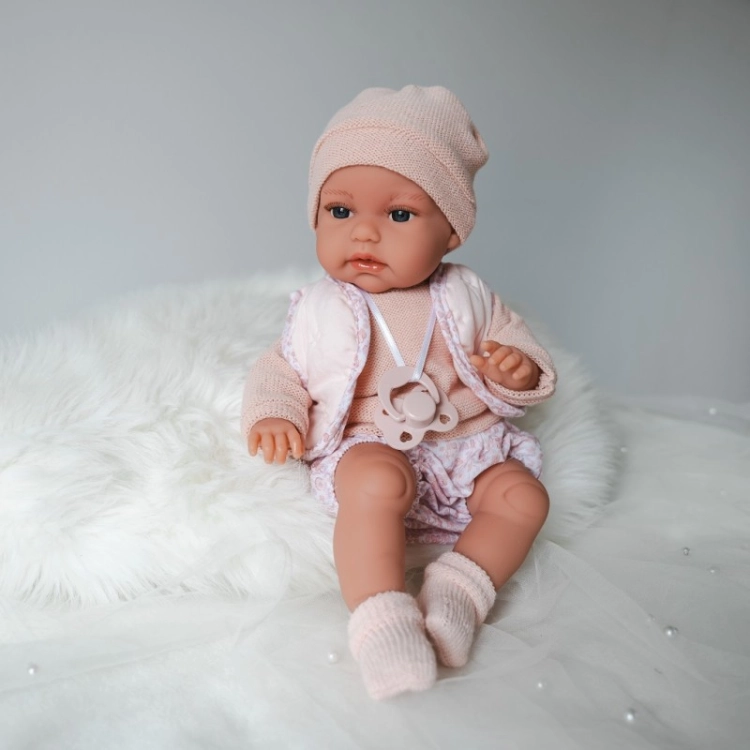 Lalka Hiszpańska 34 cm Antonio Juan 70364 Baby Toneta, bobas, elastyczny tułów, miękki brzuszek, w ciele stelaż, który pozwala na zmianę pozycji, w ubranku, smoczek, poduszka