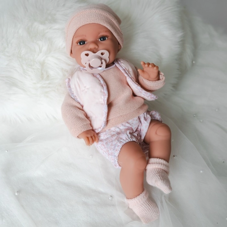 Lalka Hiszpańska 34 cm Antonio Juan 70364 Baby Toneta, bobas, elastyczny tułów, miękki brzuszek, w ciele stelaż, który pozwala na zmianę pozycji, w ubranku, smoczek, poduszka