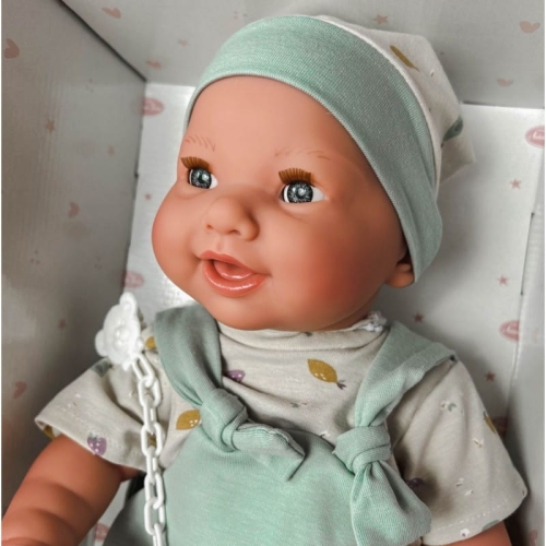 Lalka Hiszpańska 42 cm Antonio Juan 50415 Mia, bobas cały z winylu, dziewczynka, zamyka oczy, pije z buteleczki i robi siku, bez włosów, rzęsy, ubranko, smoczek, buteleczka, pieluszka pampers, koszyczek na akcesoria