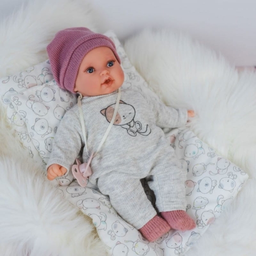 Lalka Hiszpańska 27 cm Antonio Juan 11115 Kika, bobas miękki brzuszek, płacze, mówi mama papa, bez włosów, w ubranku, magnetyczny smoczek, kołderka i poduszka