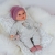 Lalka Hiszpańska 27 cm Antonio Juan 11115 Kika, bobas miękki brzuszek, płacze, mówi mama papa, bez włosów, w ubranku, magnetyczny smoczek, kołderka i poduszka