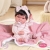 Lalka Hiszpańska 33 cm Antonio Juan 60146 Baby Toneta, bobas cały z winylu, dziewczynka, ciemne krótkie włosy, ubranko, smoczek, dwustronny kocyk