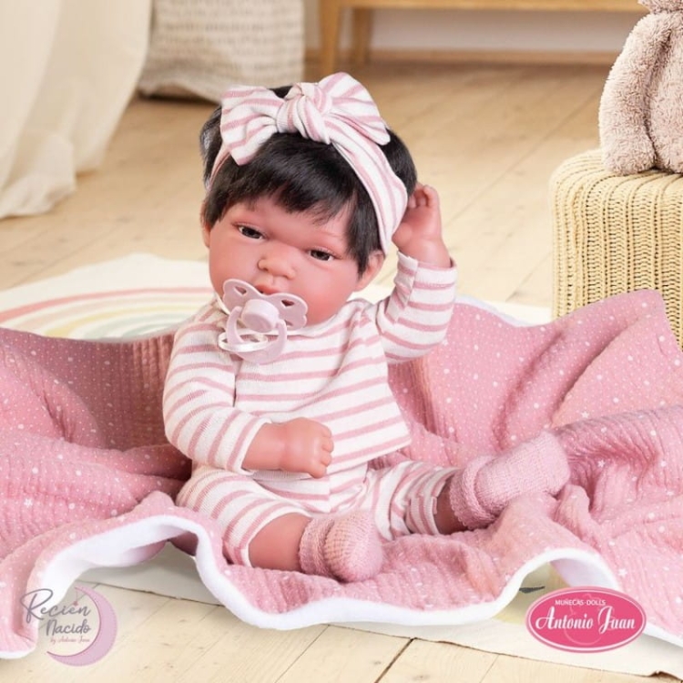 Lalka Hiszpańska 33 cm Antonio Juan 60146 Baby Toneta, bobas cały z winylu, dziewczynka, ciemne krótkie włosy, ubranko, smoczek, dwustronny kocyk