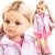 Lalka Hiszpańska 32 cm Paola Reina Amigas 04685 Rosa, klasyczna, cała z winylu, niebieskie oczy, jasnoblond perłowe włosy spięte w dwa kucyki, różowa kurteczka z kapturem i kieszeniami, różowa sukienka, majteczki, różowe botki